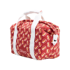 Angled view of red patterned duffle bag featuring repeating cheese icons, white carry handles, and zip top closure showing depth and side panel