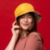 Sargento Grilled Cheese Bucket Hat worn with solid yellow side facing out