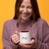 Sargento Serious About Cheese Mug held in both hands showing the Sargento logo