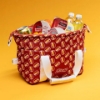 Sargento Cheeseburger Cooler Bag filled with drinks and snacks, showing white handles and Sargento logo