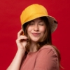 Sargento Grilled Cheese Bucket Hat worn with solid yellow side facing out