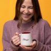 Sargento Serious About Cheese Mug held in both hands showing the Sargento logo