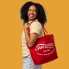 Sargento Heritage Tote Bag worn over the shoulder in red with white Sargento logo and “Est. 1953” heritage graphic