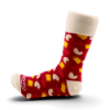 Side view of Sargento Balanced Breaks Snacks Sock showing red patterned design and cream cuff, heel, and toe